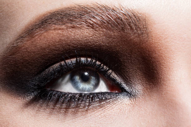 istock Close up macro beauty eyes with professional make up 1127809646