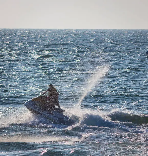 Photo of Young people  riding a jet ski / wave runner in Goa competing