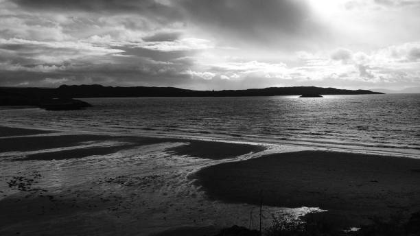 istock beautiful view over a Scottish lake in the sunset with cloudy sky 1127809696