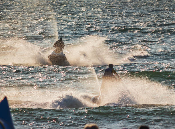 istock Young people  riding a jet ski / wave runner in Goa competing 1127809709