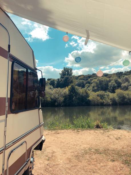 istock camping with old hymer on a nice river main in Germany 1127810289