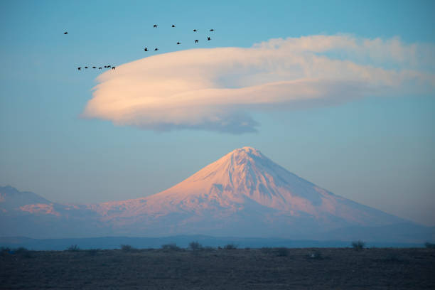 istock Mount Ararat (Greater Ararat), with snow on summit, on clear day with minimal clouds, and fields below, on the border between Turkey and Armenia, viewed from eastern Turkey 1127810376