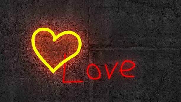 istock the shining golden heart on rough concrete wall. 3D Render 1127811260