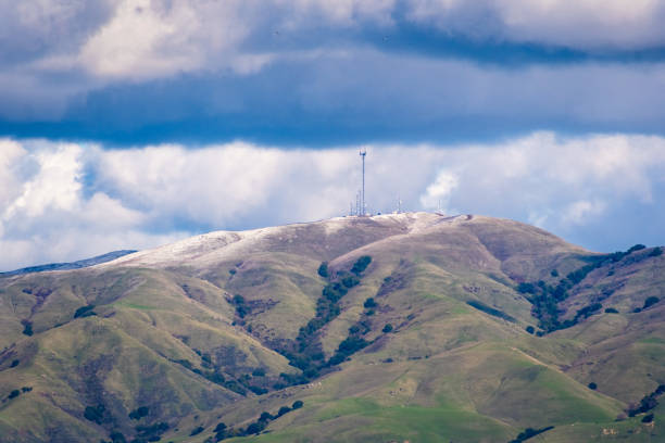 Photo of View towards Monument Peak on a cold winter day; some snow still present on the ground; storm clouds covering the sky; south San Francisco bay area, California