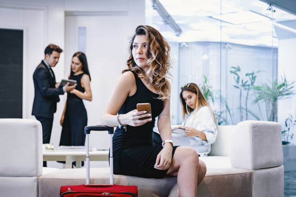 istock Business people sitting on sofa in lounge area 1127816775