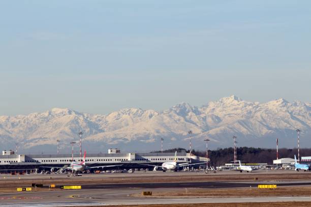 Malpensa Airport, Milan, Italy - 06 February 2019: View over Terminal 1 with Mount Rosa, second highest peak of the Alps in the background.