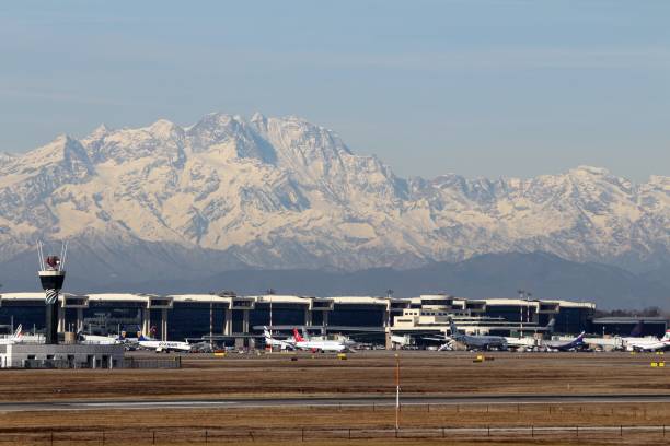 Malpensa Airport, Milan, Italy - 06 February 2019: View over Terminal 1 with Mount Rosa, second highest peak of the Alps in the background.