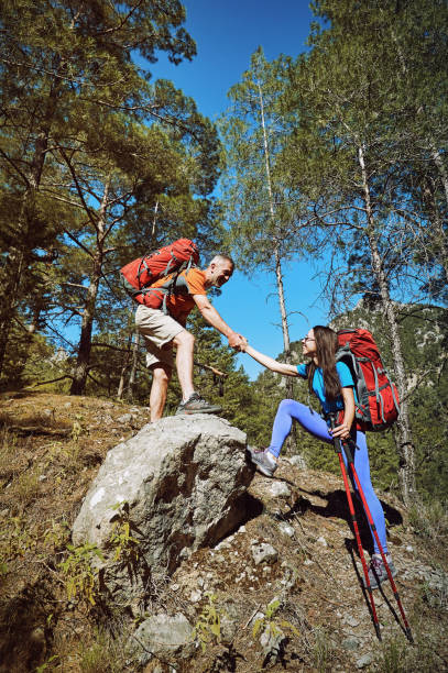 istock A helping hand high in the mountains in the summer hike 1127818375