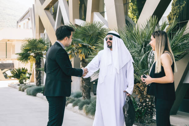 istock Executive Businessman shaking hands with a Arab Businessman outdoor 1127818862