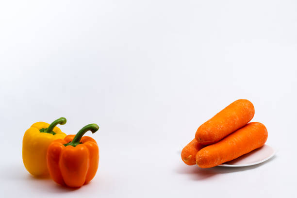 Capsicum - Bell Pepper green, red, orange, yellow isolated in plain extendable background, macro detailing, studio lighting, with ample copy space all around.