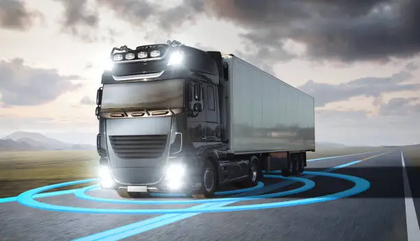 A moving truck on a highway. Blue graphics around the truck visualize an advanced driving technology.