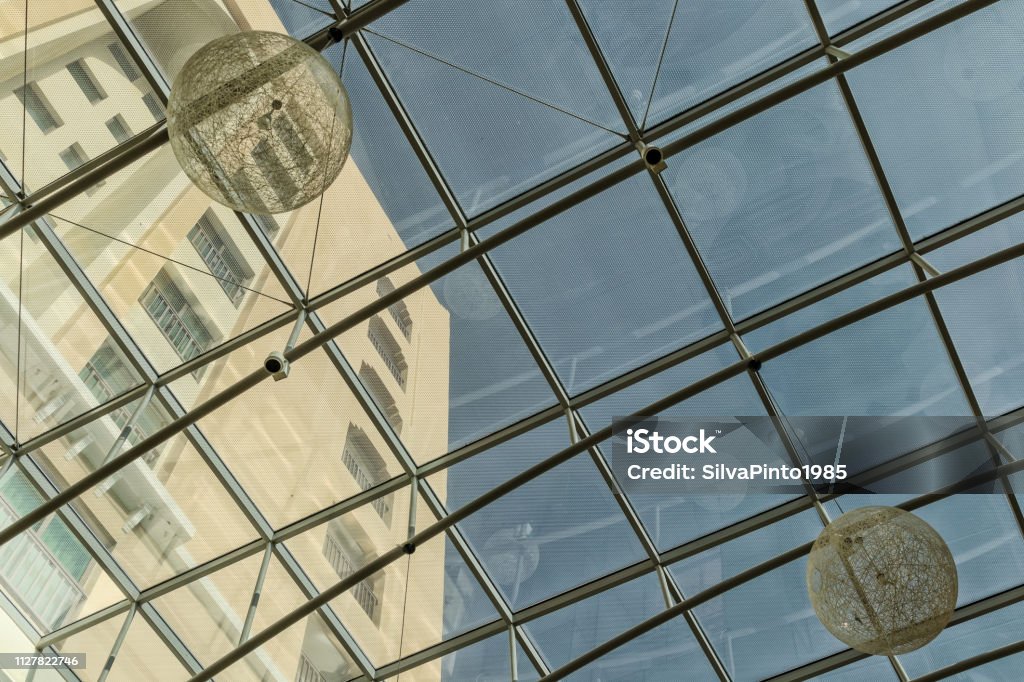 Modern glass ceiling with lamps. Abstract Stock Photo