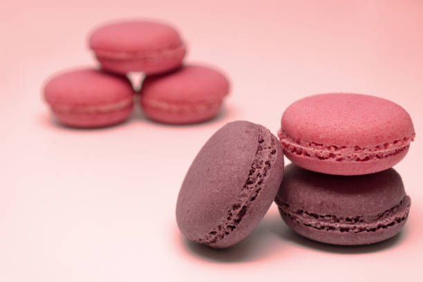 istock Pink and chocolate macaroons lie on each other 1127824058