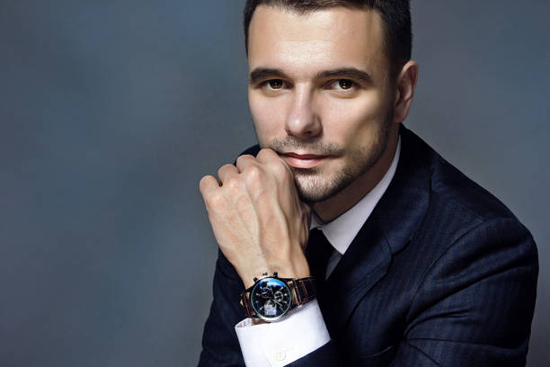 istock man in a blue jacket and watch 1127827246