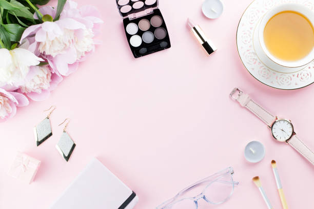istock Beautiful cosmetics and flowers flat lay with note book, herbal tea on pastel background. 1127827540