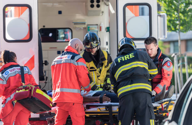 Firefighters Helping Rescue Team stock photo