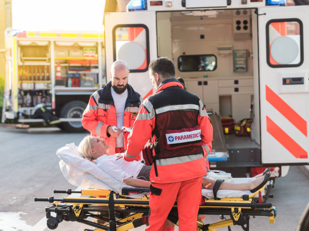 istock Paramedic Team Helping Injured Woman 1127827778
