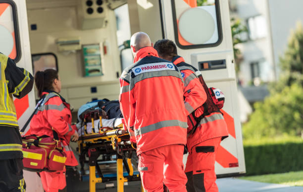 Rescue Team Helping Victim Of Car Crash stock photo