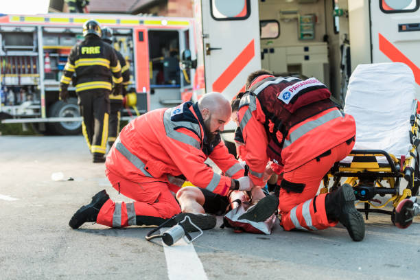 istock Paramedic Team Helping Injured Cyclist 1127827927
