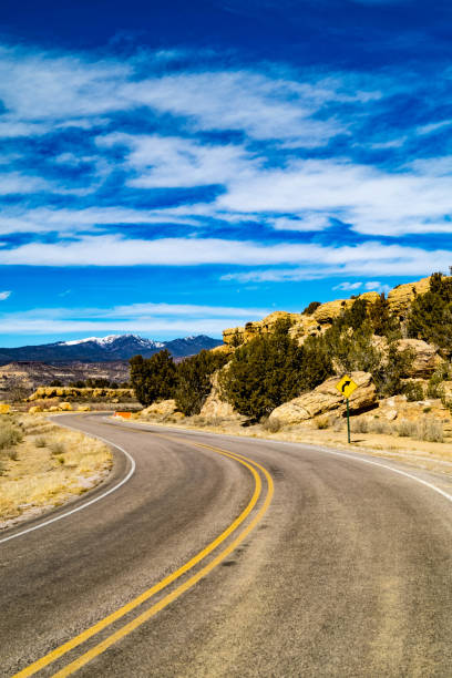 istock Old Route 66 passing natural rock formations near Cubero, New Mexico 1127828037