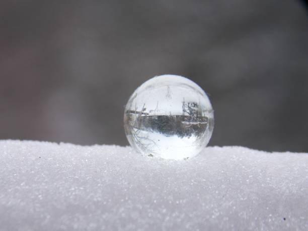 istock glass ball on the snow 1127833635