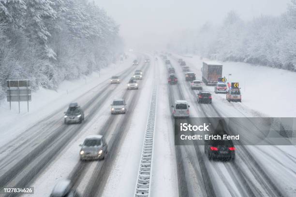 Snow Covered Highway In Austria With Cars Out Of Focus Stock Photo - Download Image Now