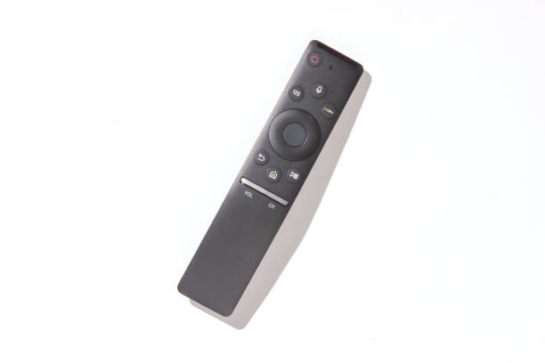 istock Modern tv remote on a white background. Photo with shadows, hard light, top view 1127836282