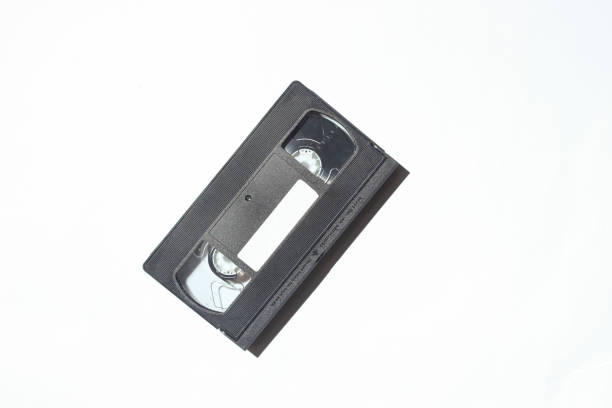 白い背景のビデオ カセット。レトロな技術。影、ハードライトと写真 - television the media old information medium ストックフォトと画像