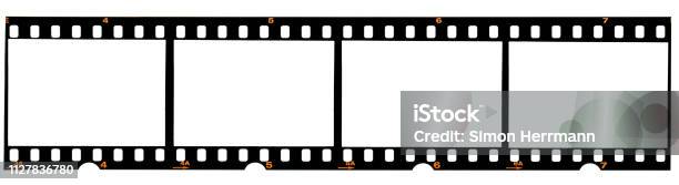Real 35mm Film Strip On White Analogue Photo Frame Placeholder Stock Photo - Download Image Now