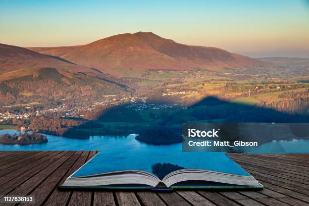 Beautiful Late Afternoon Autumn Fall Landscape Image Of The View From Catbells Near Derwent Water In The Lake District Coming Out Of Pages Of Open Story Book Stock Photo - Download Image Now