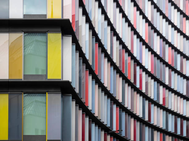 istock Abstract architecture background detail of multi colored vibrant window panels 1127838743
