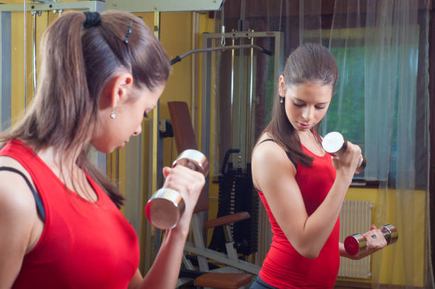 istock Woman exercising at home 1127838831