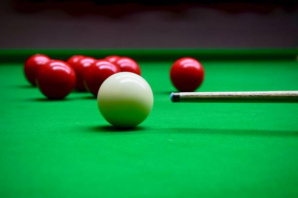 Snooker game Snooker game with cue on the billard table and white and red balls ready to play billard queue stock pictures, royalty-free photos & images