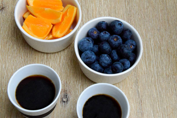 istock Black coffee and fresh fruit in bowls 1127839280