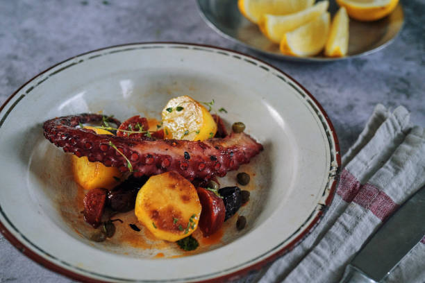 istock Octopus Tentacles with Potatoes and Fresh Lemon 1127841834