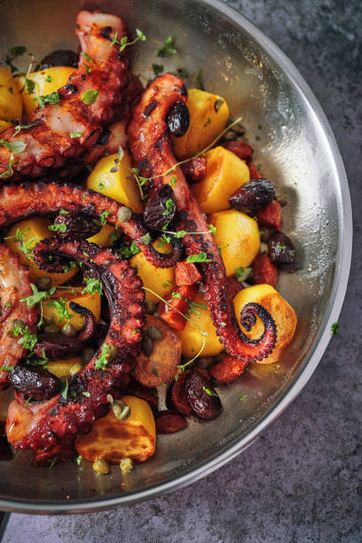 istock Octopus Tentacles with Potatoes and Fresh Lemon 1127841844
