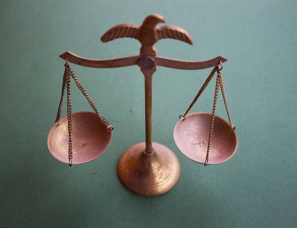 istock Weighing scales on green background 1127844568