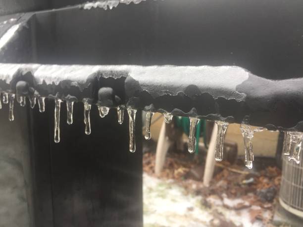 istock Icicles in a line starting to melt 1127845370