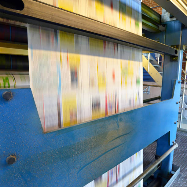 istock printing of coloured newspapers with an offset printing machine at a printing press 1127847647
