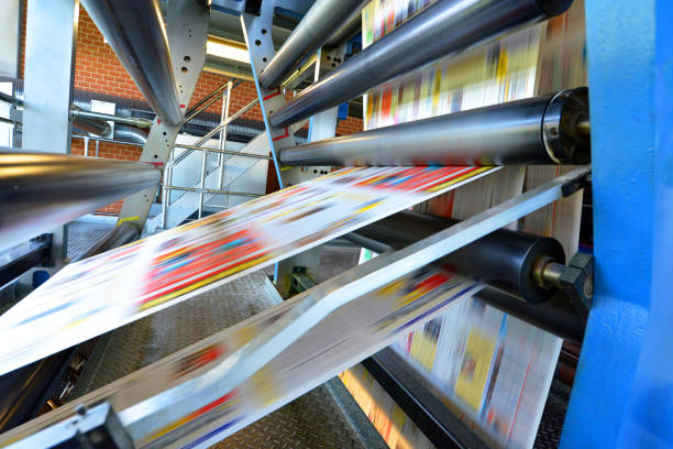 istock printing of coloured newspapers with an offset printing machine at a printing press 1127847679