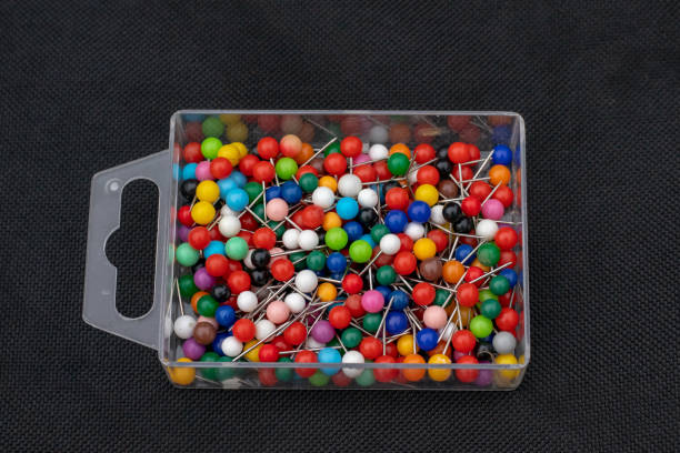 istock Box of coloured map pins 1127847968