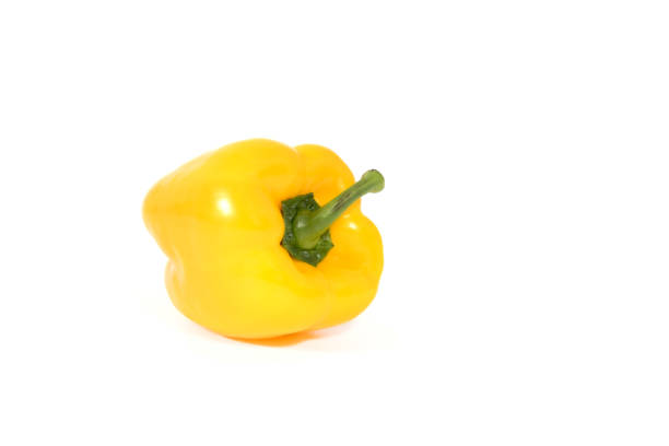 Yellow  fresh and healthy peppers on white background