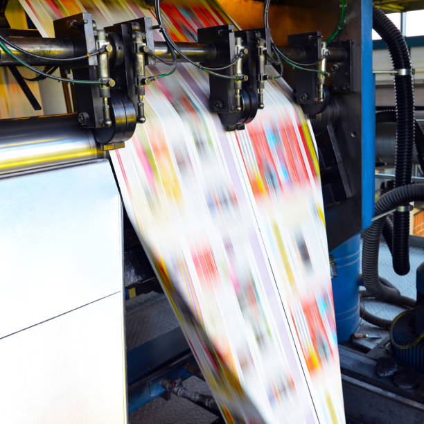 istock printing of coloured newspapers with an offset printing machine at a printing press 1127849651