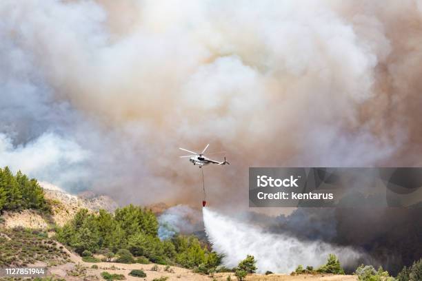 Helicopter Dropping Water For Fire Fighting Stock Photo - Download Image Now - Climate Change, Nature, Fire - Natural Phenomenon