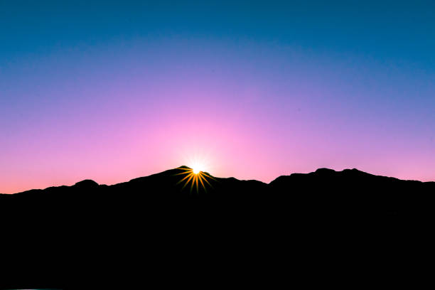 Sunburst Mountain Silhouette stock photo