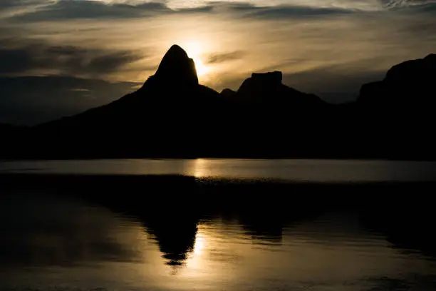 Sunset on the Rodrigo de Freitas Lagoon in the southern zone of Rio de Janeiro, Brazil attracts tourists from all over the world and locals to watch this spectacle of nature