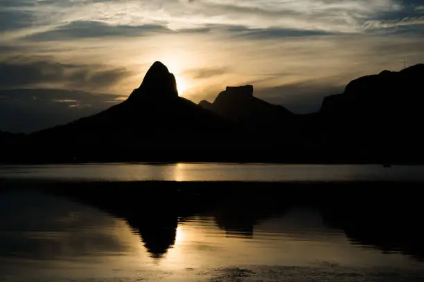 Sunset on the Rodrigo de Freitas Lagoon in the southern zone of Rio de Janeiro, Brazil attracts tourists from all over the world and locals to watch this spectacle of nature