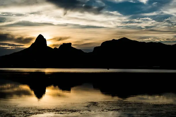 Sunset on the Rodrigo de Freitas Lagoon in the southern zone of Rio de Janeiro, Brazil attracts tourists from all over the world and locals to watch this spectacle of nature