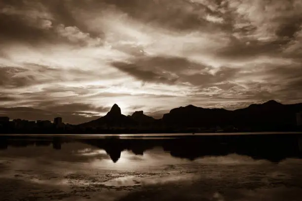 Sunset on the Rodrigo de Freitas Lagoon in the southern zone of Rio de Janeiro, Brazil attracts tourists from all over the world and locals to watch this spectacle of nature