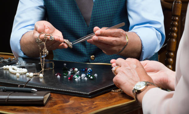 istock Consumerism- customers choosing gift in a jewelry store 1127854336